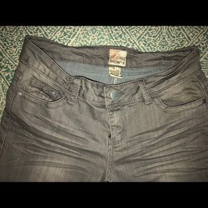 Grey skinny jeans with ankle zipper detail